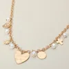 Fashnzfab Brushed Metal Heart Cross Pearl Charm Station Chunky Necklace - Cream, Worn Gold In Multi