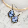 Fashnzfab Cameo Accented Stone Embellished Dangle Earrings In Blue