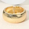 Fashnzfab Chunky Hammered Metal Hinged Bangle Bracelet In Gold