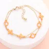 Fashnzfab Colored Flower Crisscross Station Double Layered Bracelet Orange In Orange