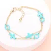 Fashnzfab Colored Flower Crisscross Station Double Layered Bracelet Turquoise In Blue