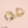 Fashnzfab Crystal Centered Elegant Cut Out Flower Stud Earrings In Gold