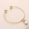 Fashnzfab Crystal Cz Stone Pouch Charm Cuff Bracelet Gold In Gold