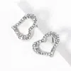 Fashnzfab Crystal Heart Cutout Stud Earrings In Metallic