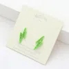 Fashnzfab Crystal Paved Lightning Stud Earrings In Green