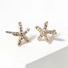 Fashnzfab Crystal Paved Starfish Stud Earrings In Gold