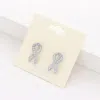 Fashnzfab Crystal Pink Ribbon Stud Earrings In Multi