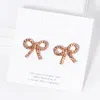 Fashnzfab Crystal Stone Studded Ribbon Stud Earrings In Gold