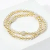 Fashnzfab Cz Shamballa Ball Metal Ball Beaded Stretch Bracelet In Gold