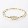 Fashnzfab Cz Stone Paved Buckle Accent Twisted Hinged Bangle Bracelet Gold In Gold