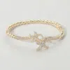 Fashnzfab Cz Stone Paved Double Starfish Twisted Hinged Bangle Bracelet Gold In Gold