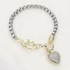 Fashnzfab Cz Stone Paved Heart Charm Bracelet Two Tone In Gray