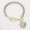 Fashnzfab Cz Stone Paved Heart Charm Bracelet Two Tone In Multi