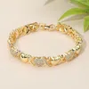 Fashnzfab Cz Stone Paved Heart Crisscross Link Bracelet - Gold In Gold