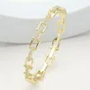 Fashnzfab Cz Stone Paved Horseshoe Buckle Hinged Bangle Bracelet - Clear, Gold In Gold