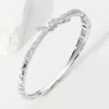 Fashnzfab Cz Stone Paved Knot Pointed Hinged Bracelet In Silver