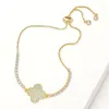 Fashnzfab Cz Stone Paved Quatrefoil Accent Pull Tie Adjustable Bracelet Clear, Gold In Multi