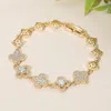 Fashnzfab Cz Stone Paved Quatrefoil Link Bracelet - Gold In Gold