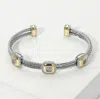 Fashnzfab Cz Stone Paved Two Tone Square Pointed Two Row Twisted Metal Cuff Bracelet Two Tone In Multi