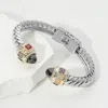 Fashnzfab Cz Stone Tip Two Tone Twisted Hinge Cuff Bracelet Jet Black In Metallic