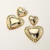 Fashnzfab Double Metal Heart Dangle Earrings In Gold