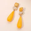 Fashnzfab Elegant Resin Teardrop Dangle Earrings In Yellow