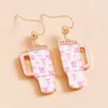 Fashnzfab Enamel Bow Pattern Tumbler Dangle Earrings In Gold