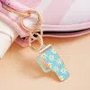Fashnzfab Enamel Daisy Floral Pattern Tumbler Back Engraved Keychain / Bag Charm In Gold
