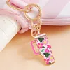 Fashnzfab Enamel Floral Pattern Tumbler Back Engraved Keychain / Bag Charm In Pink
