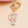 Fashnzfab Enamel Love Message Smile Face Floral Pattern Tumbler Back Engraved Keychain / Bag Charm In Multi