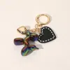 Fashnzfab Faux Leather Metal Heart Balloon Dog Bag Charm / Keychain In Multi