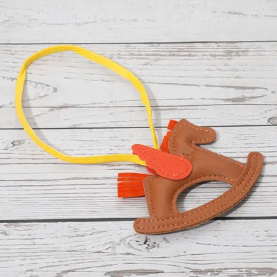 Fashnzfab Faux Leather Winged Rocking Horse Bag Charm In Brown