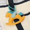 Fashnzfab Faux Leather Winged Rocking Horse Bag Charm In Yellow