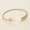 Fashnzfab Feathered Arrow Twisted Wire Cuff Bracelet Worn Gold In Multi