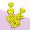 Fashnzfab Felt Back Beaded Triple Heart Link Dangle Earrings In Yellow