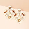 Fashnzfab Felt Back Flower Pointed Seed Beaded Heart Dangle Earrings In Gold