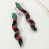 Fashnzfab Felt Back Seed Beaded Snake Earrings In Black