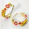 Fashnzfab Flower Beads Hoop Earrings In Yellow