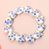 Fashnzfab Flower Ceramic Heart Beaded Stretch Bracelet Blue, Gold In Multi
