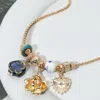 Fashnzfab Flower Heart Ceramic Ball Charm Beaded Necklace In Gold