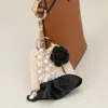 Fashnzfab Flower Pearl Tweed Jacket Keychain / Bag Charm In Sand