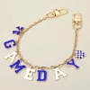 Fashnzfab Football Game Day Message Bow Heart Charm Station Bag Chain Charm In Gold