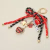 Fashnzfab Football Themed Charm Game Day Message Beaded Rope Bow Accent Keychain Bag Charm In Multi