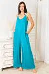 Fashnzfab Full Size Soft Rayon Spaghetti Strap Tied Wide Leg Jumpsuit In Blue