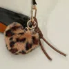 Fashnzfab Fuzzy Plush Leopard Heart Faux Leather Knot Tie Keychain / Bag Charm In Multi
