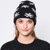 Fashnzfab Gem Flower Beanie Hat In Black