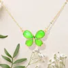 Fashnzfab Glass Stone Butterfly Cluster Pendant Necklace In Green