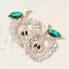 Fashnzfab Glass Stone Pave Apple Earrings In Metallic