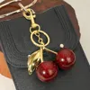 Fashnzfab Glittered Cherry Keychain / Bag Charm In Red
