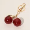 Fashnzfab Glittered Cherry Keychain / Bag Charm In Red